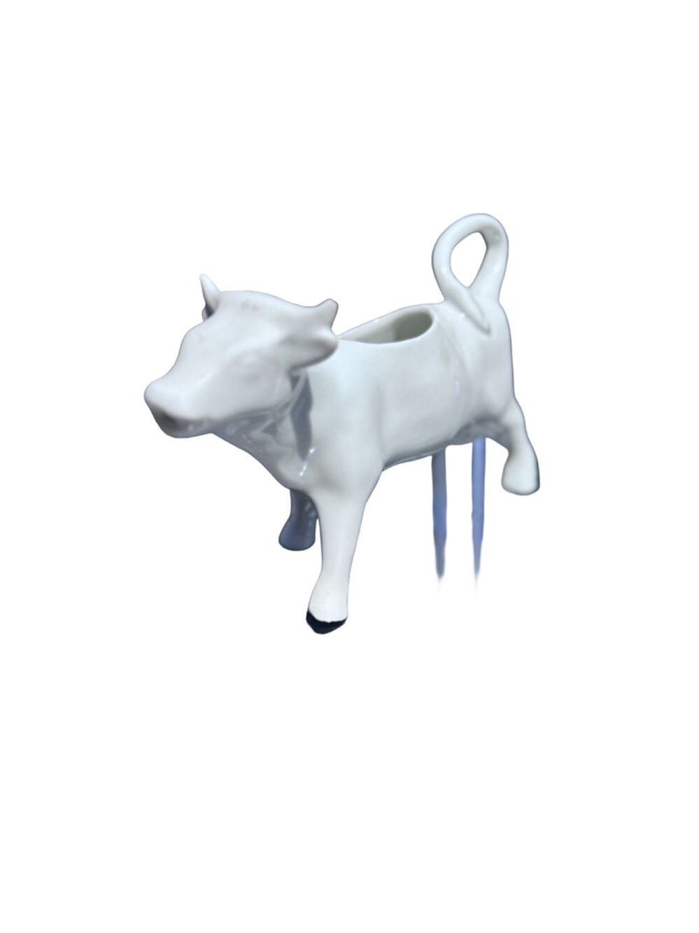 White cow creamer tail is handle. The nose is the spout white. France